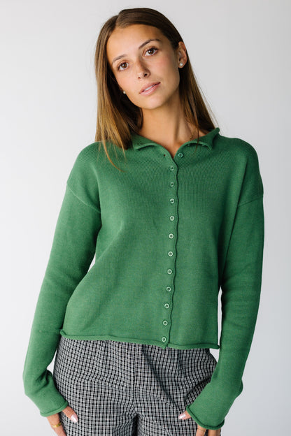 Woman wearing a modest long sleeve button cardigan with a collar and long sleeves