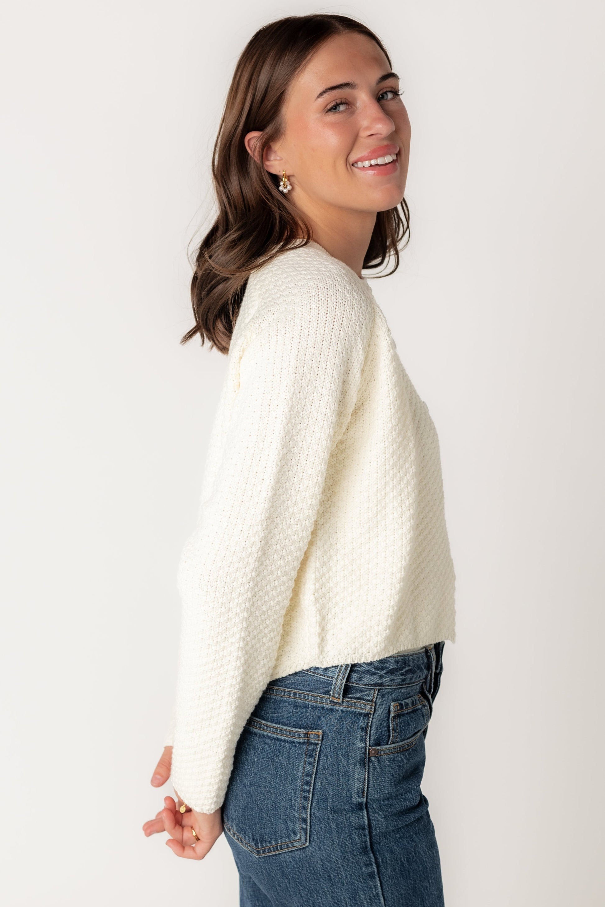 Side view of long sleeve textured cardigan