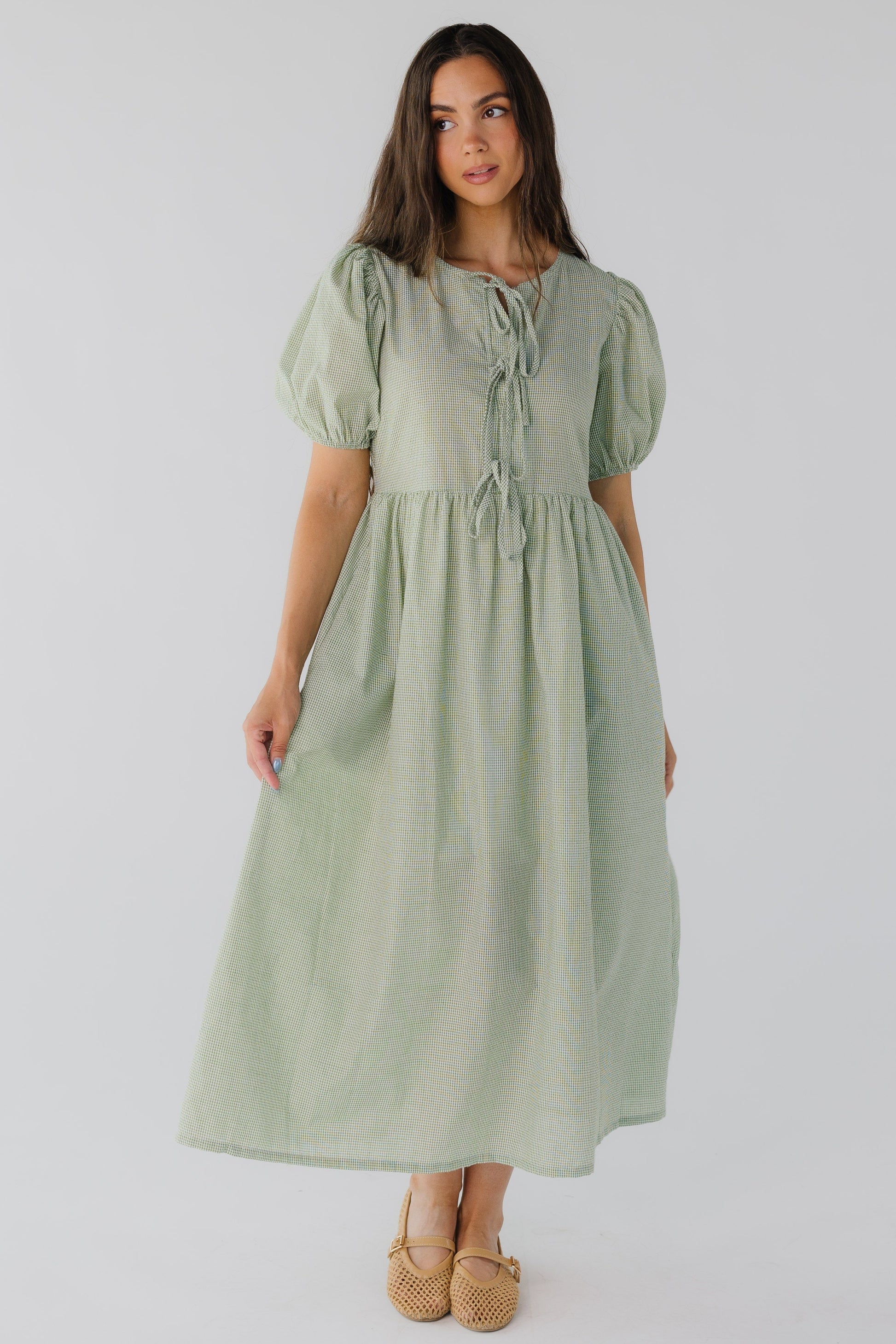 Green gingham midi with short puff sleeves and round neckine