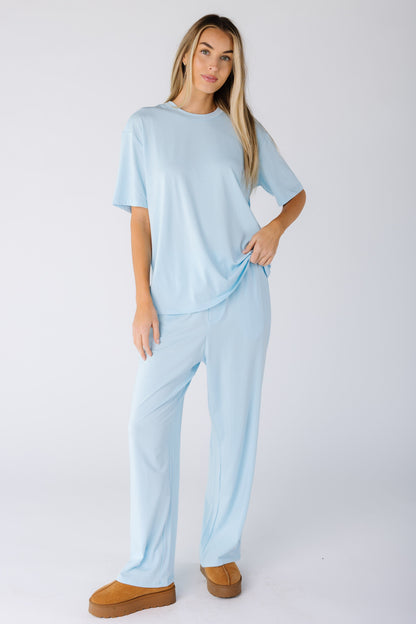 Woman wearing a modest lounge set with shorter sleeves and full length bottoms