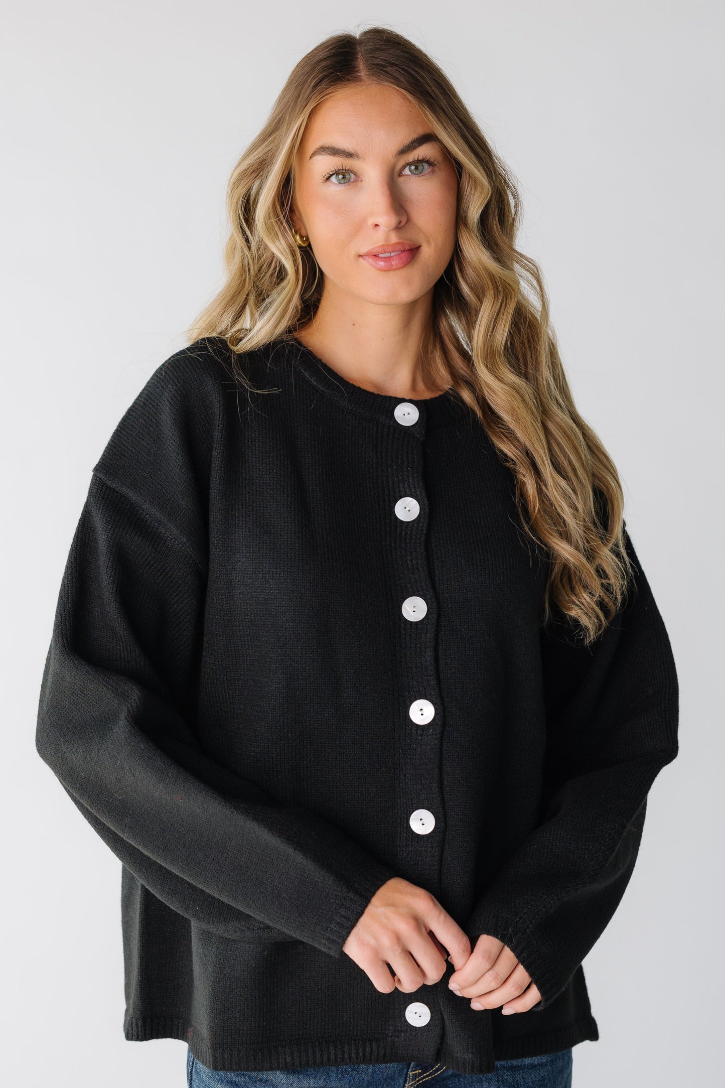 Let It Be Cardigan for women in black with contrasting white buttons