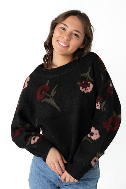 Thick black sweater with scattered floral pattern