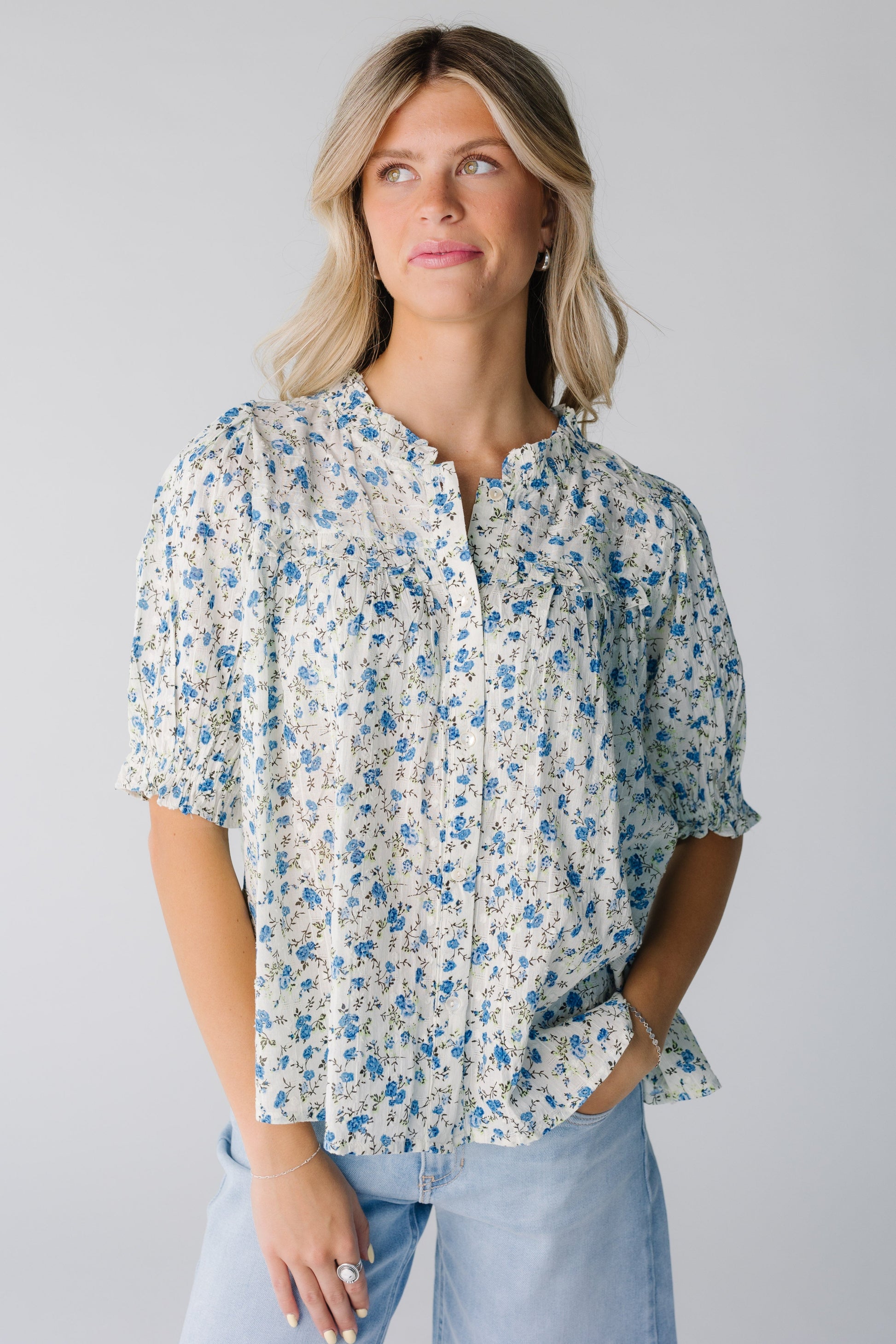Button down blue floral top with yoke and ruffles