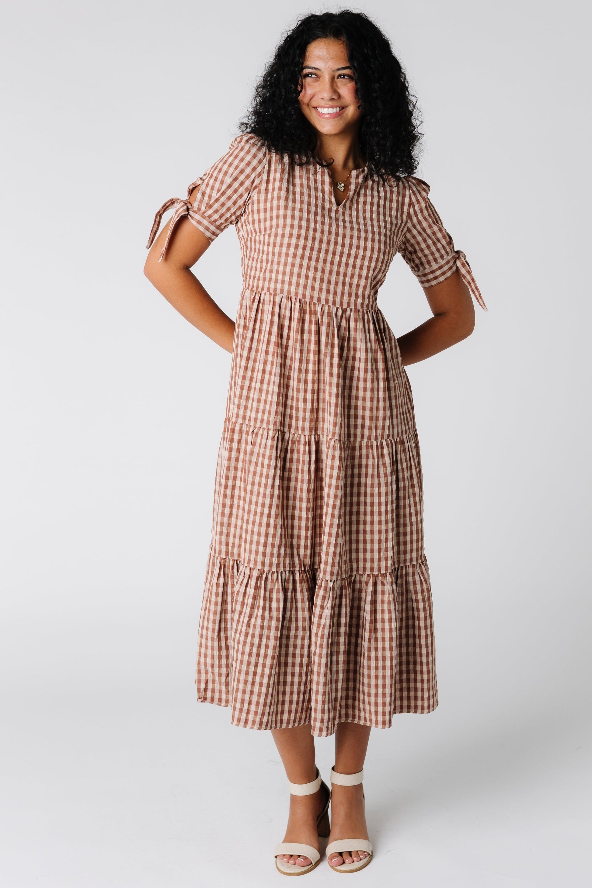 Modest midi length dress with short sleeves and gathered tiers