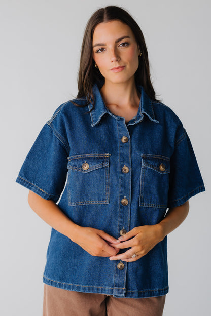 Dark denim women's button down shirt with contrasting buttons and front patch pockets