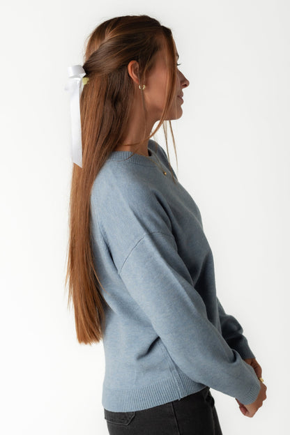 Side view of blue drop shoulder sweater with long sleeves