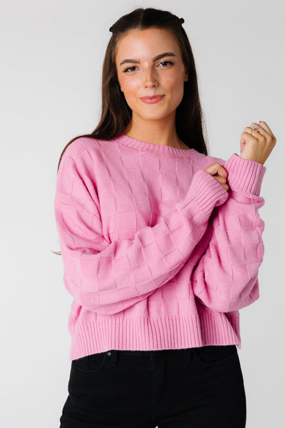 Pink long sleeve sweater with square textured pattern