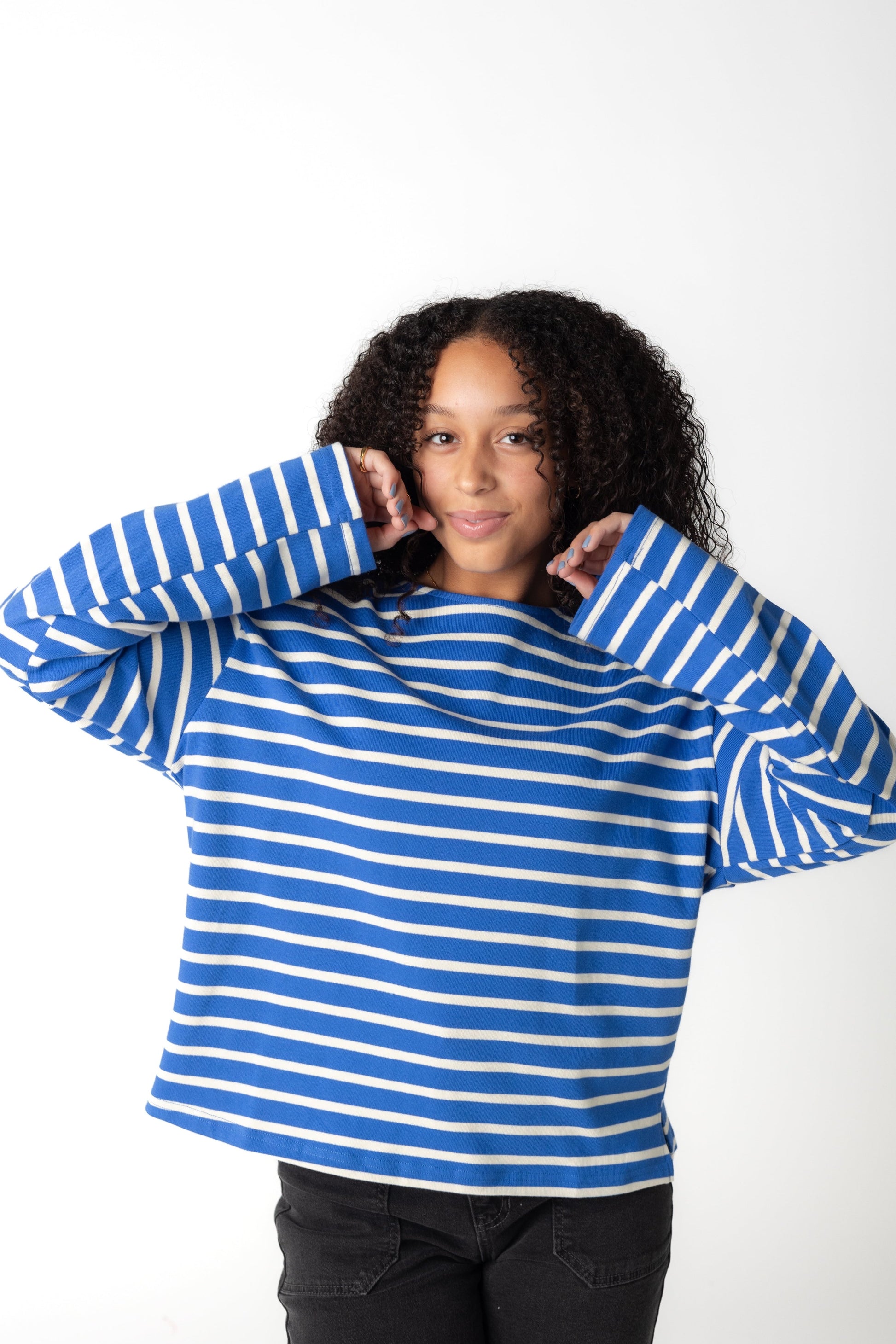 Loose fitting blue and white stripe top with loose long sleeves