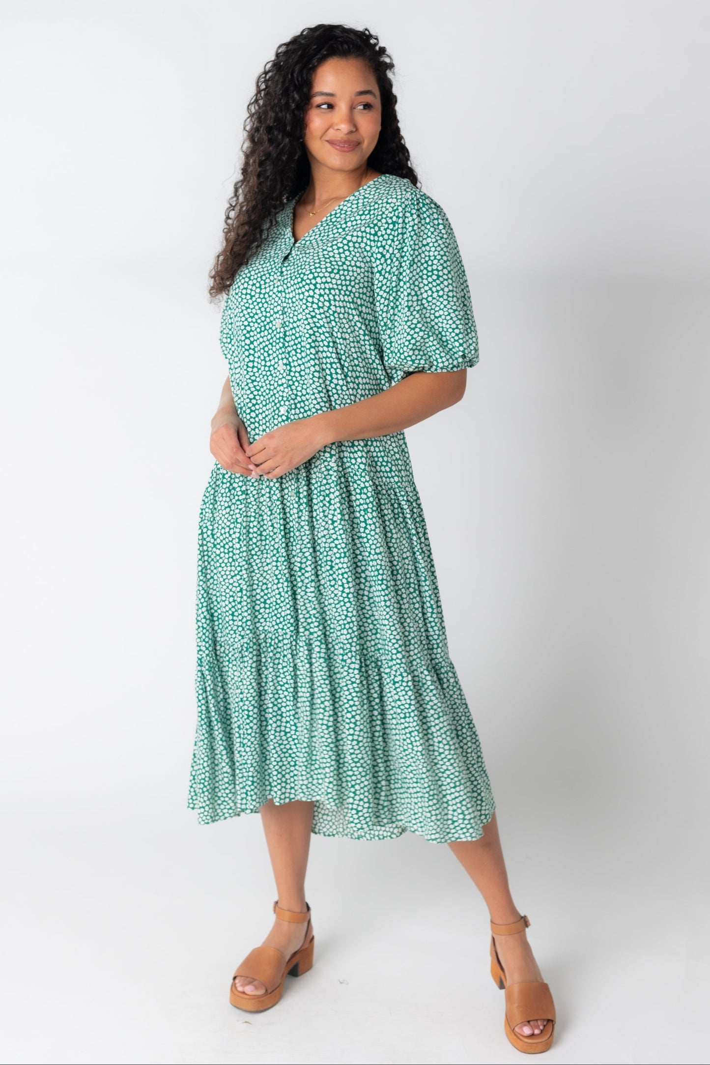 Green and white print midi dress with V-neckline and half length balloon sleeves