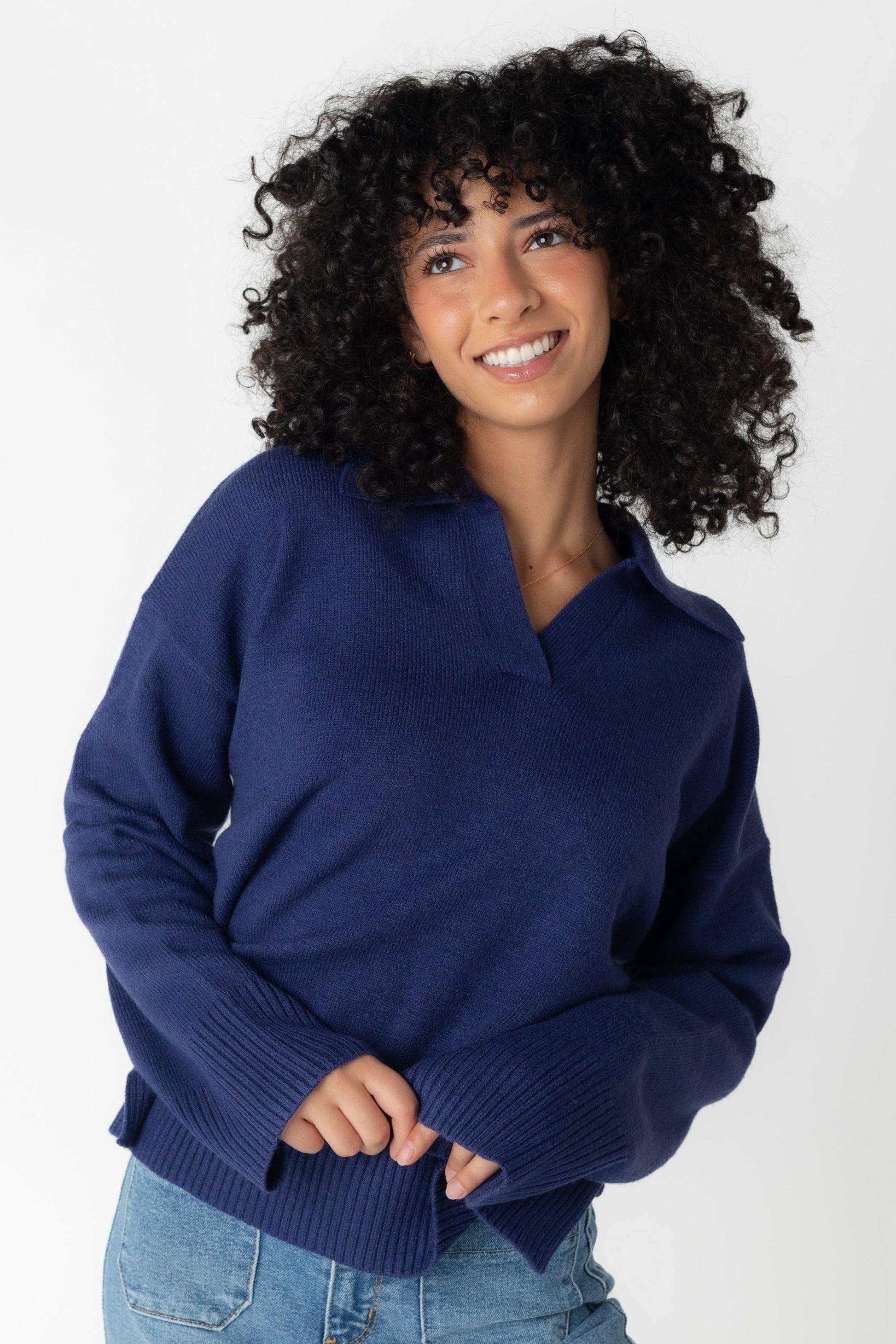 Navy loose sweater with long loose sleeves and V-neckline