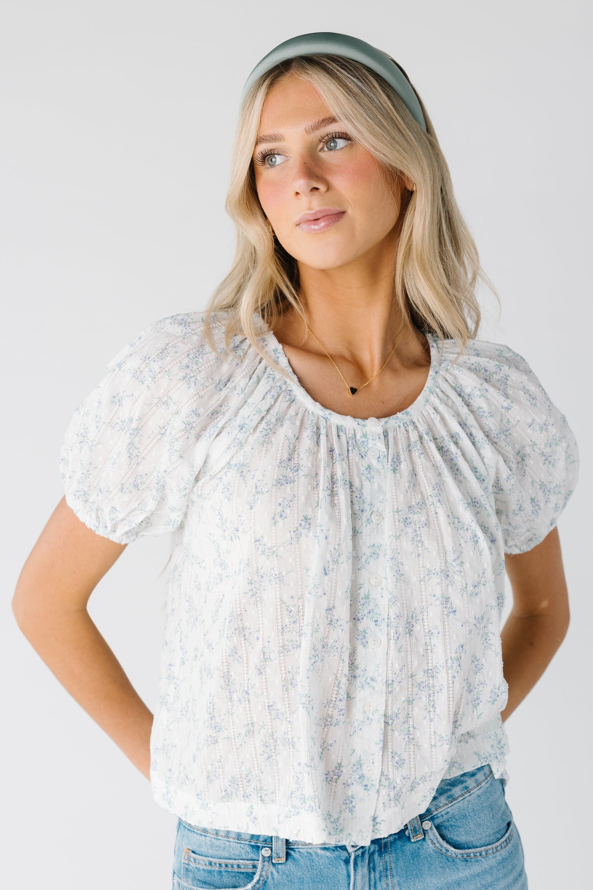 Bettini scoop neck button down top with short sleeves and blue floral print