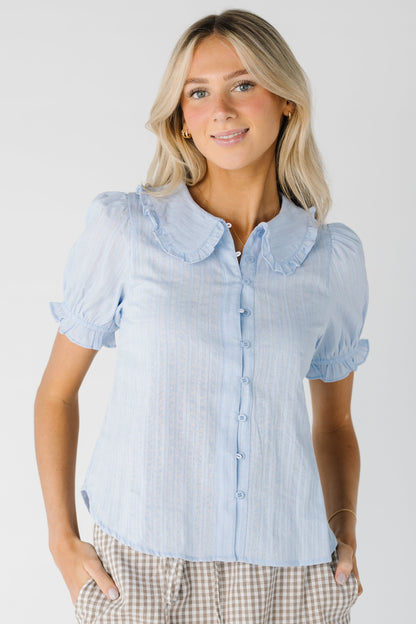 Short sleeve light blue button down top with rounded collar