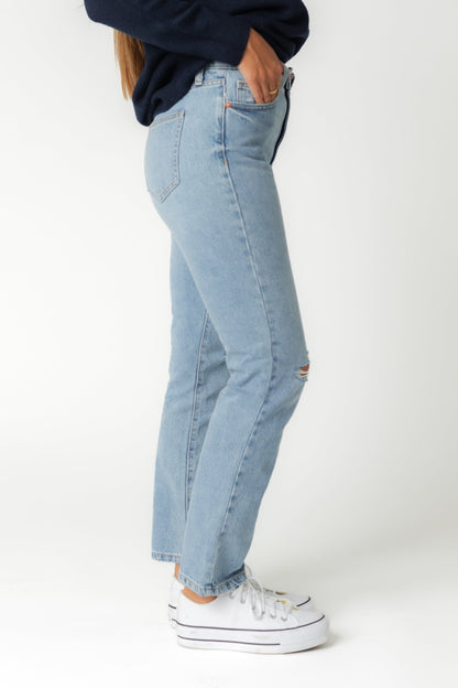 Side view of medium straight le jeans with light distressing