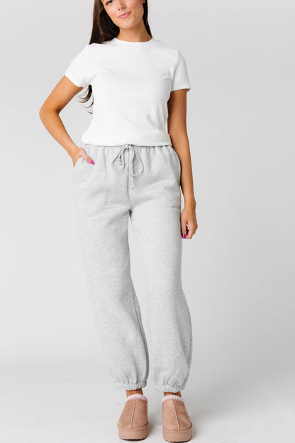 Very soft grey sweatpants with wide pockets and elastic and drawstring waist