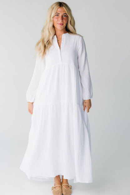Modest women's white maxi dress with V-neckline and long sleeves