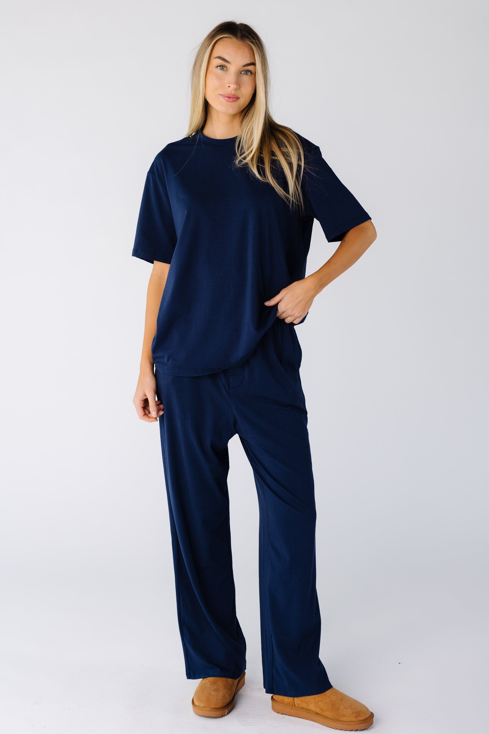 Woman wearing a modest 2 piece lounge set with round neckline with short sleeves and long length bottoms
