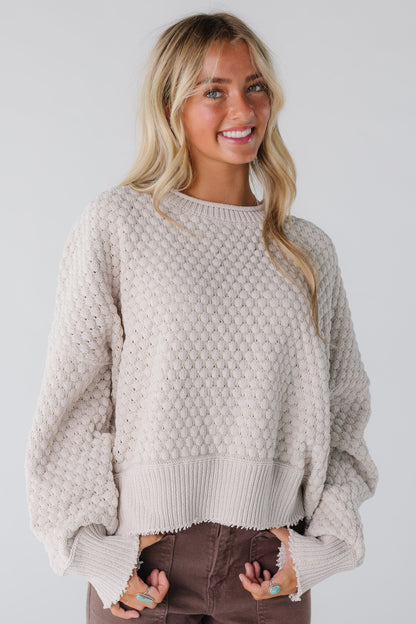 Modest natural textured sweater with long sleeves and rolled neckline