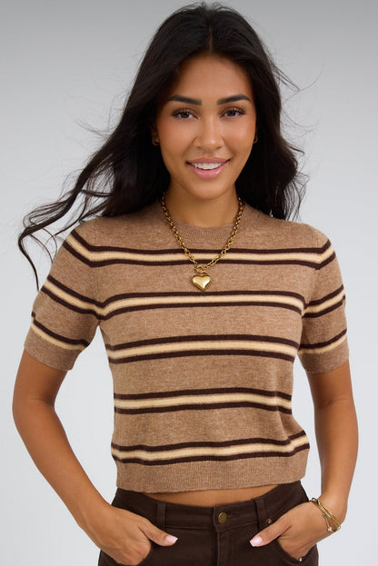 Young woman wearing a light brown stripe, lightweight stripe sweater with a round ribbed necklie and short sleeves.