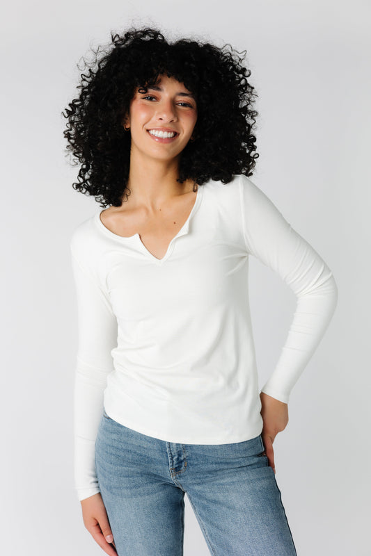 White close fitting ribbed tee with notched neckline and long sleeves