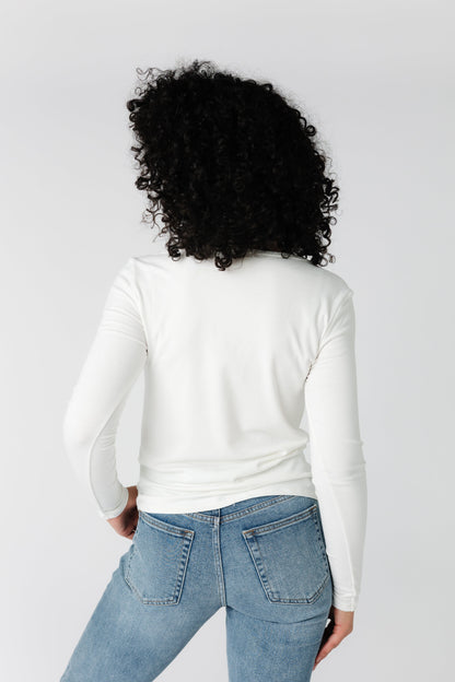 Back view of white ribbed long sleeve knit top