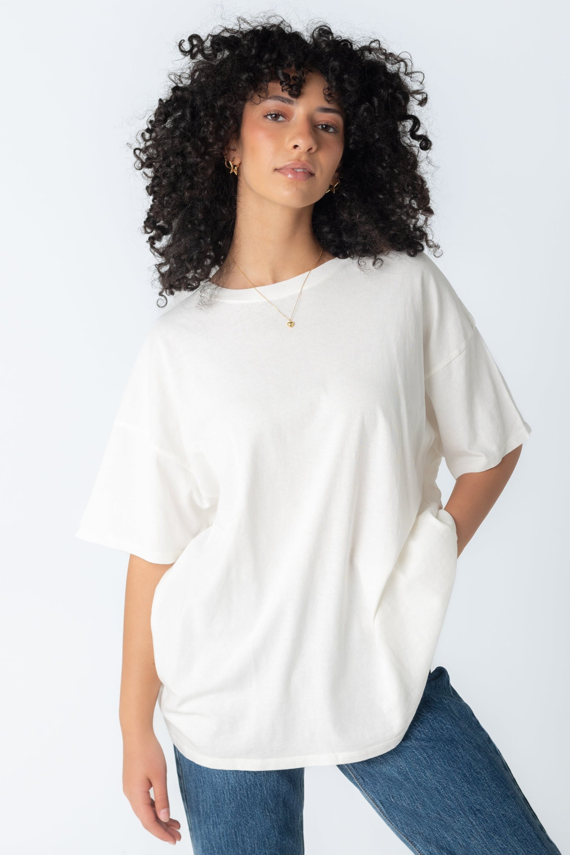 Off white oversized tee with crew neckline and short sleeves