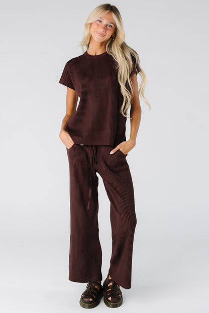Woman wearing a brown ribbed sweater set
