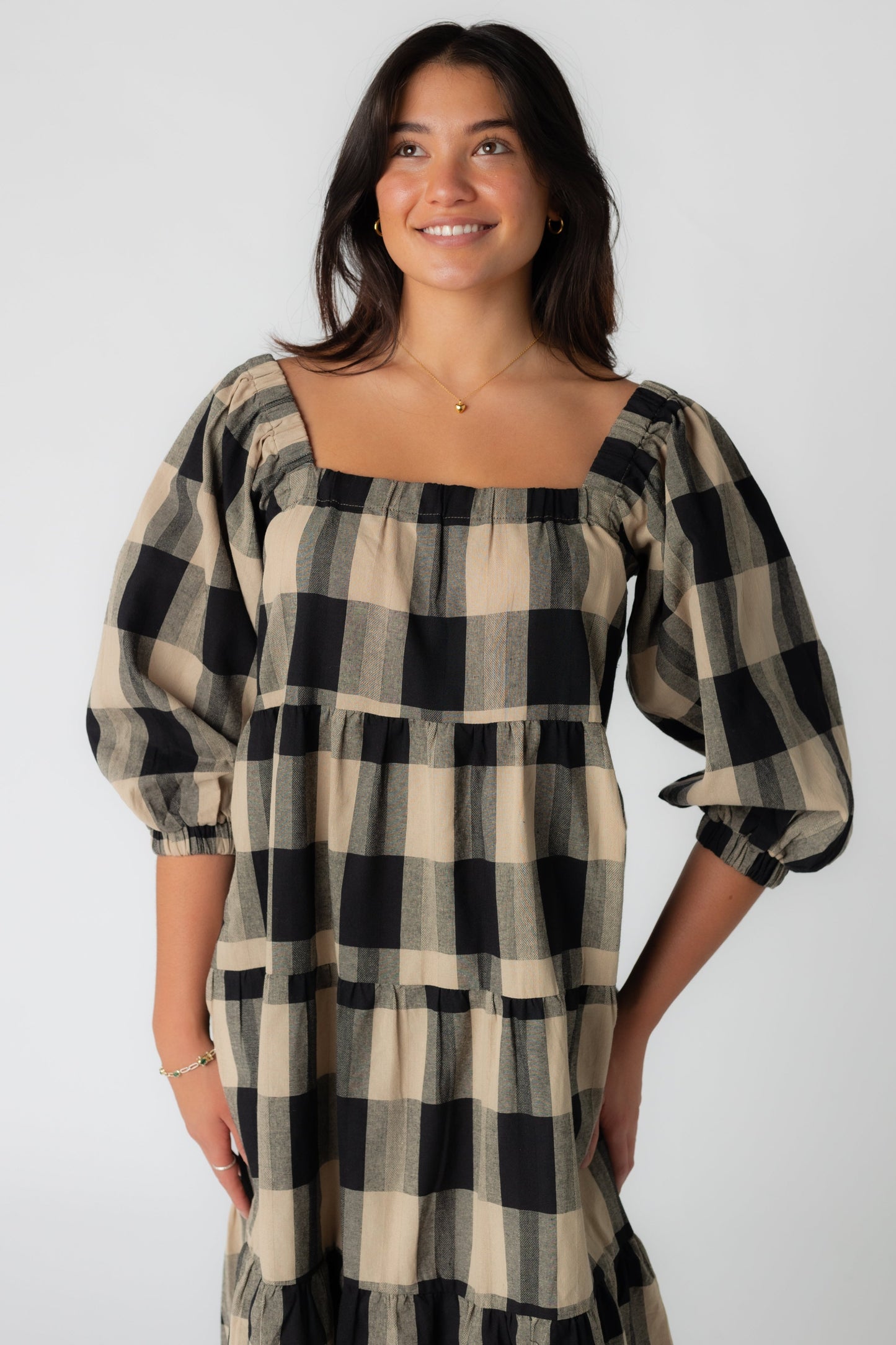 Close view of plaid dress with square neckline