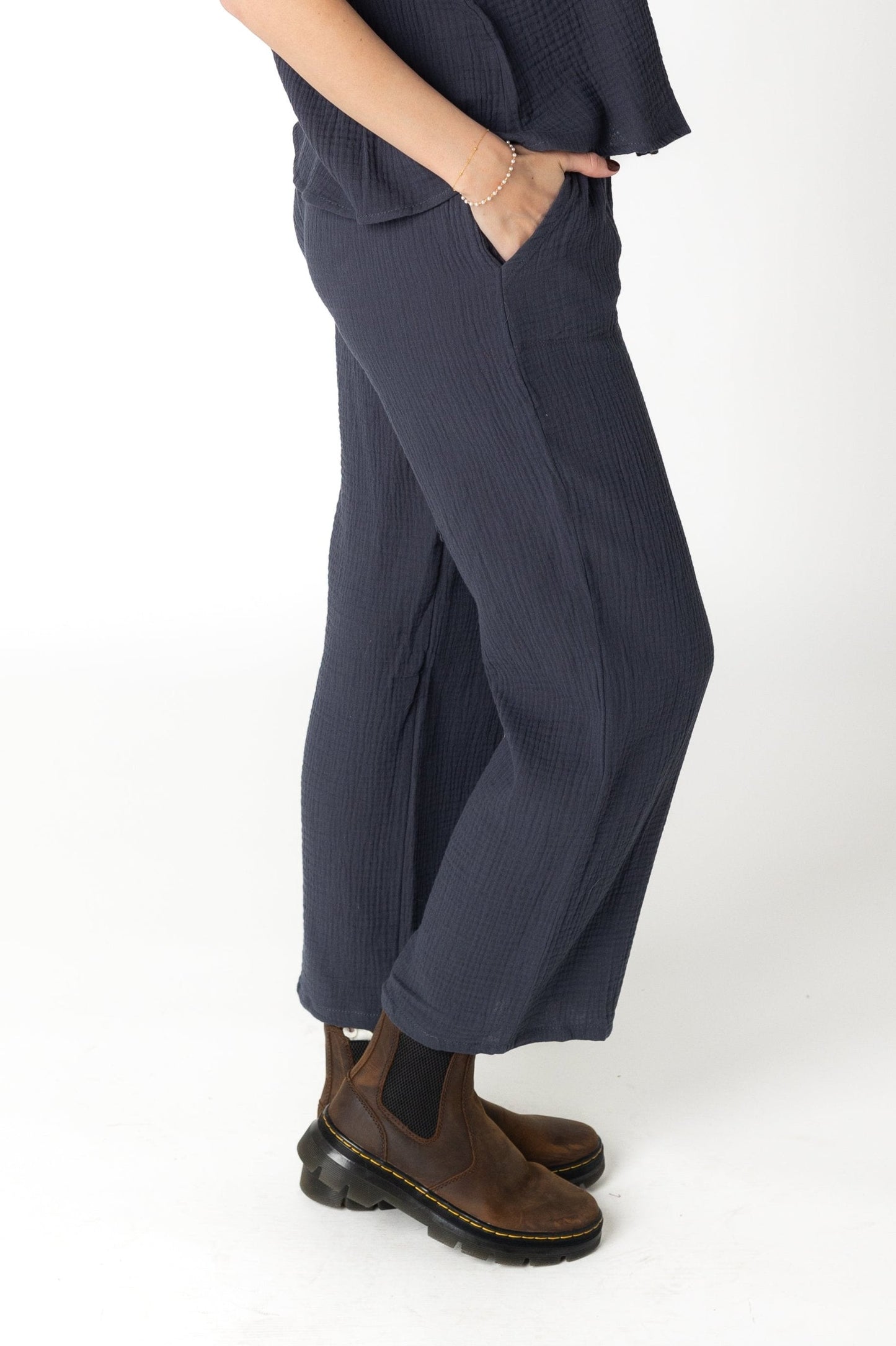 Side view of charcoal gauzy wide leg pant