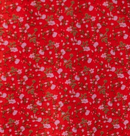 Red floral print fabric swatch.