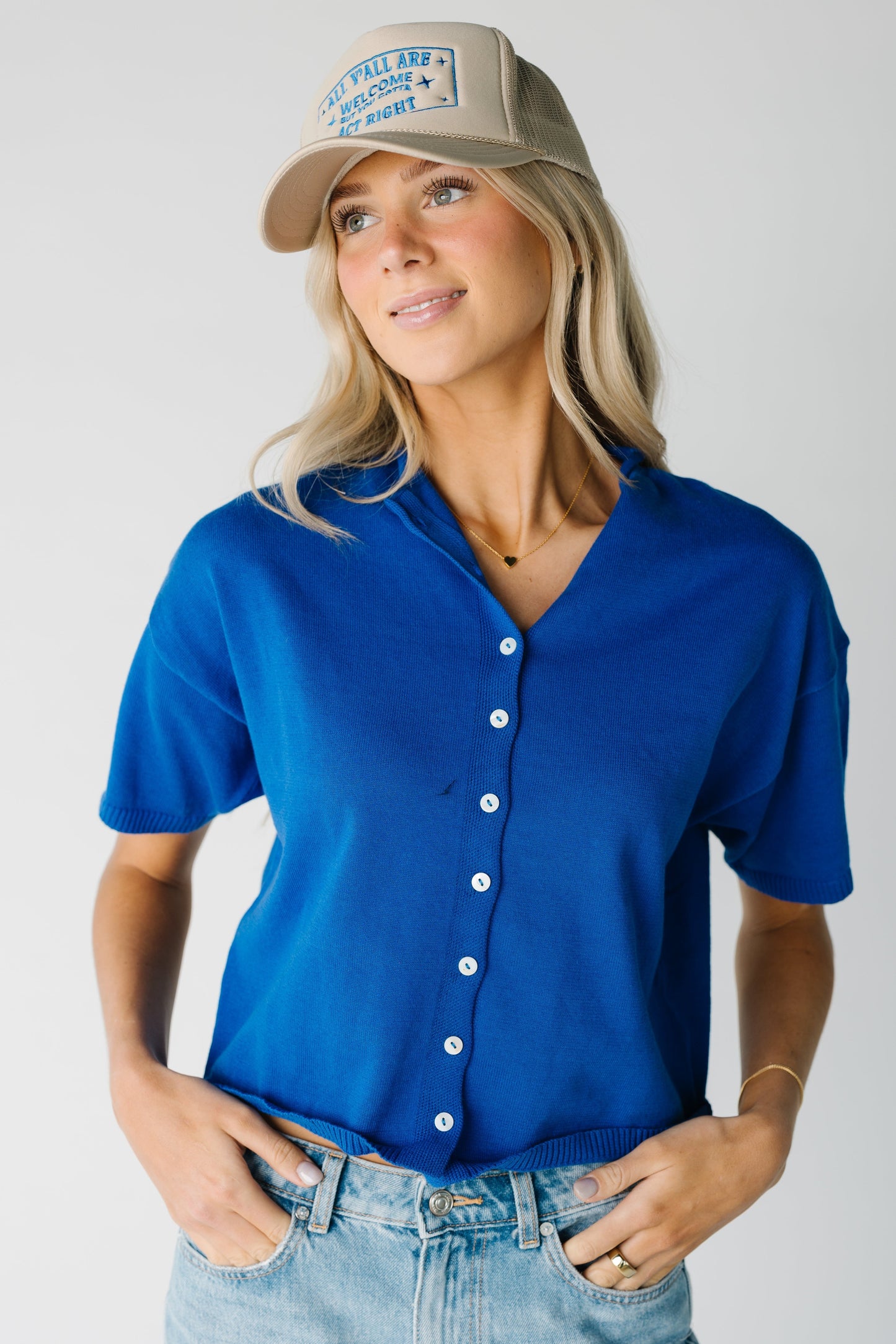 Cobalt blue button down top with contrasting buttons and short sleeves