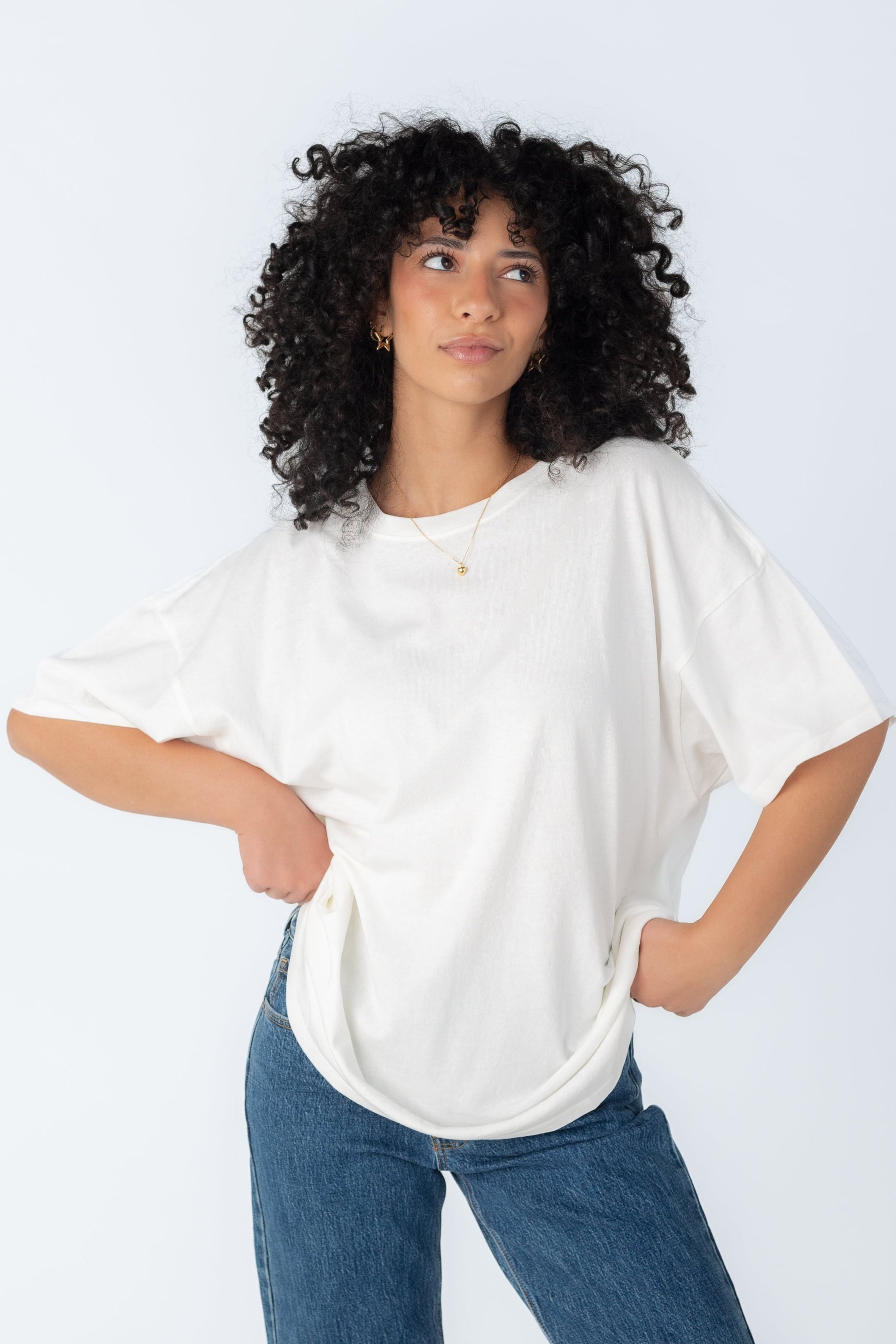 Loose off white tee with crew neckline and elbow length sleeves