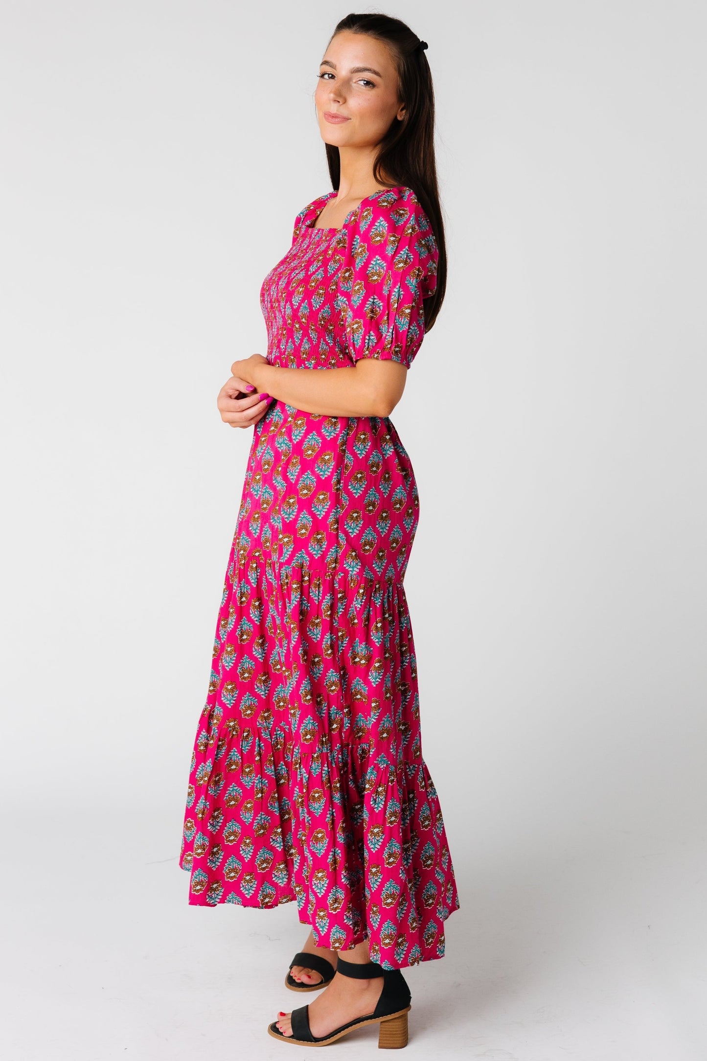 Side view of Kingston bold pink midi with smocked bodice and short sleeves