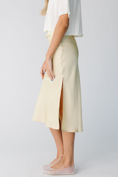 Side view of light yellow close fitting skirt