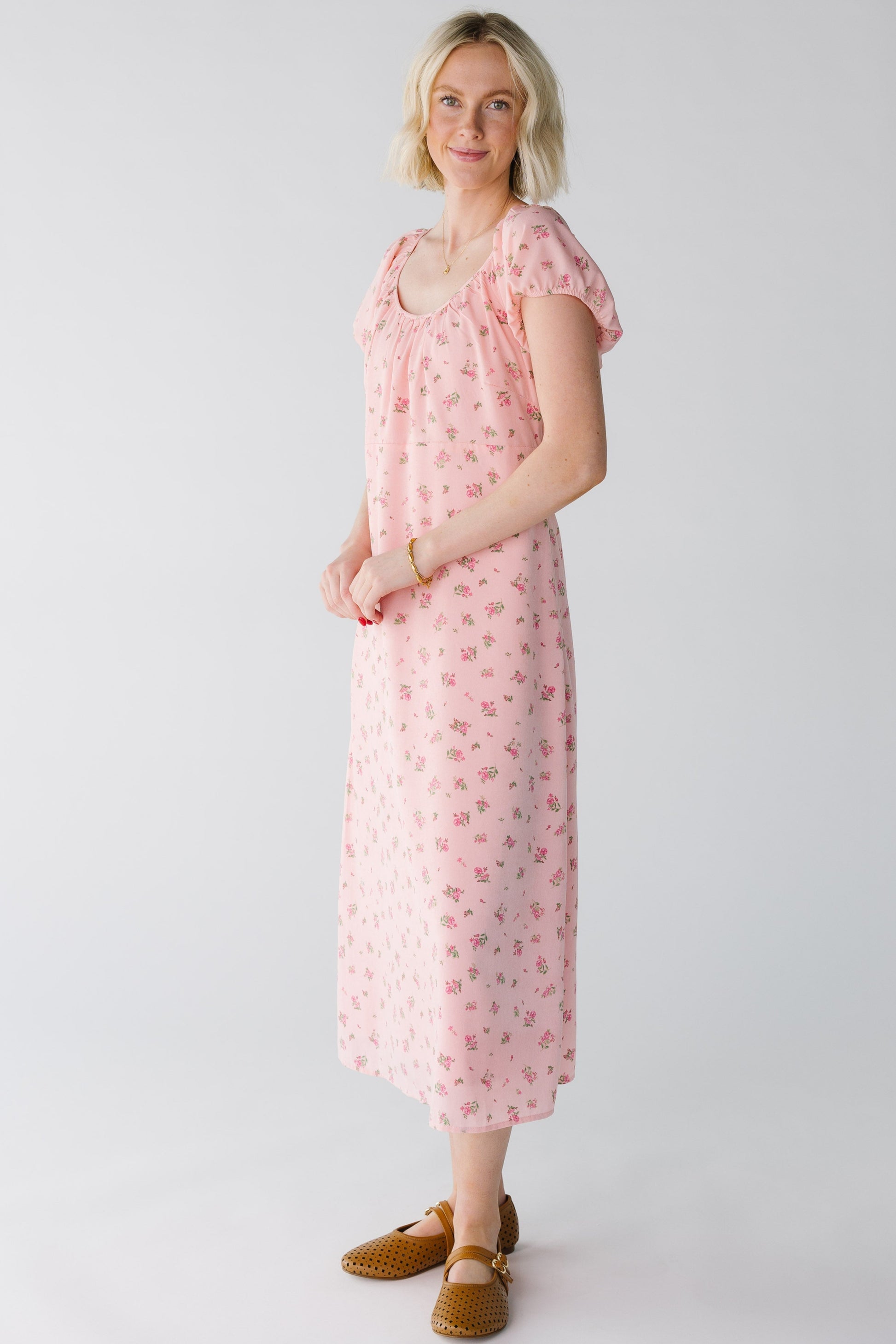 Side view of light pink floral midi dress