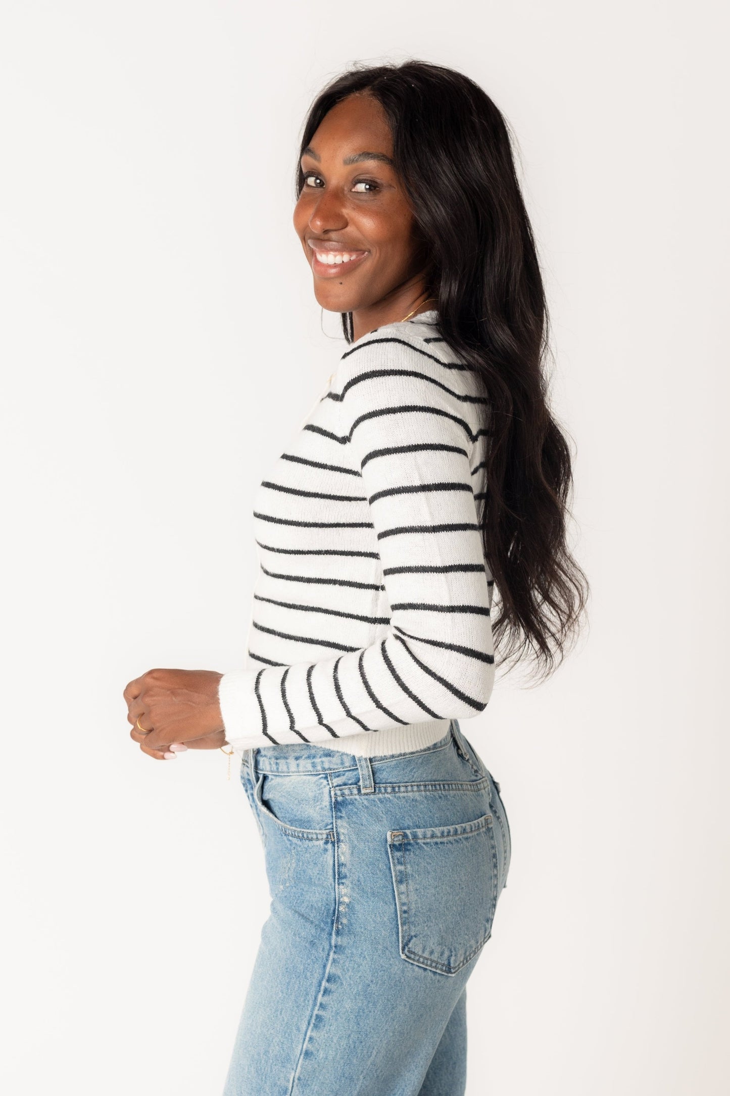 Side view of ivory and charcoal stripe cardigan with long sleeves