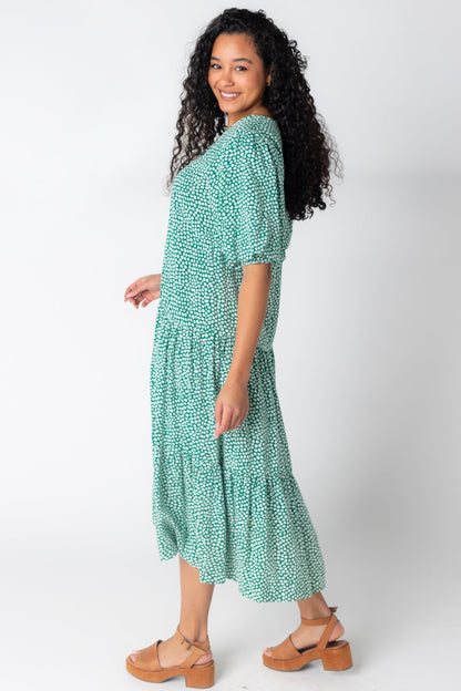 Side view of green and white print midi with full  half length sleees