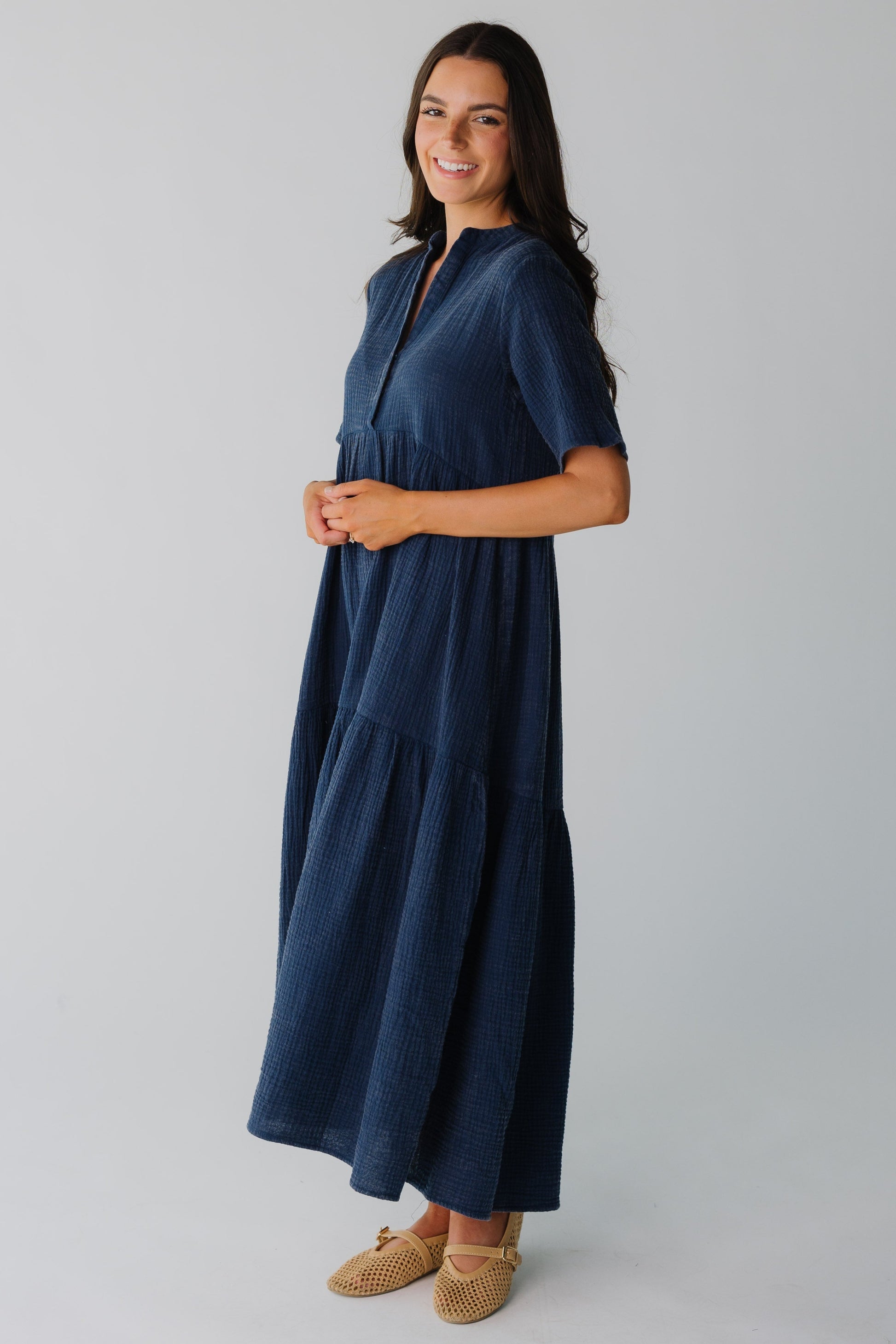 Side view of navy women's midi dress
