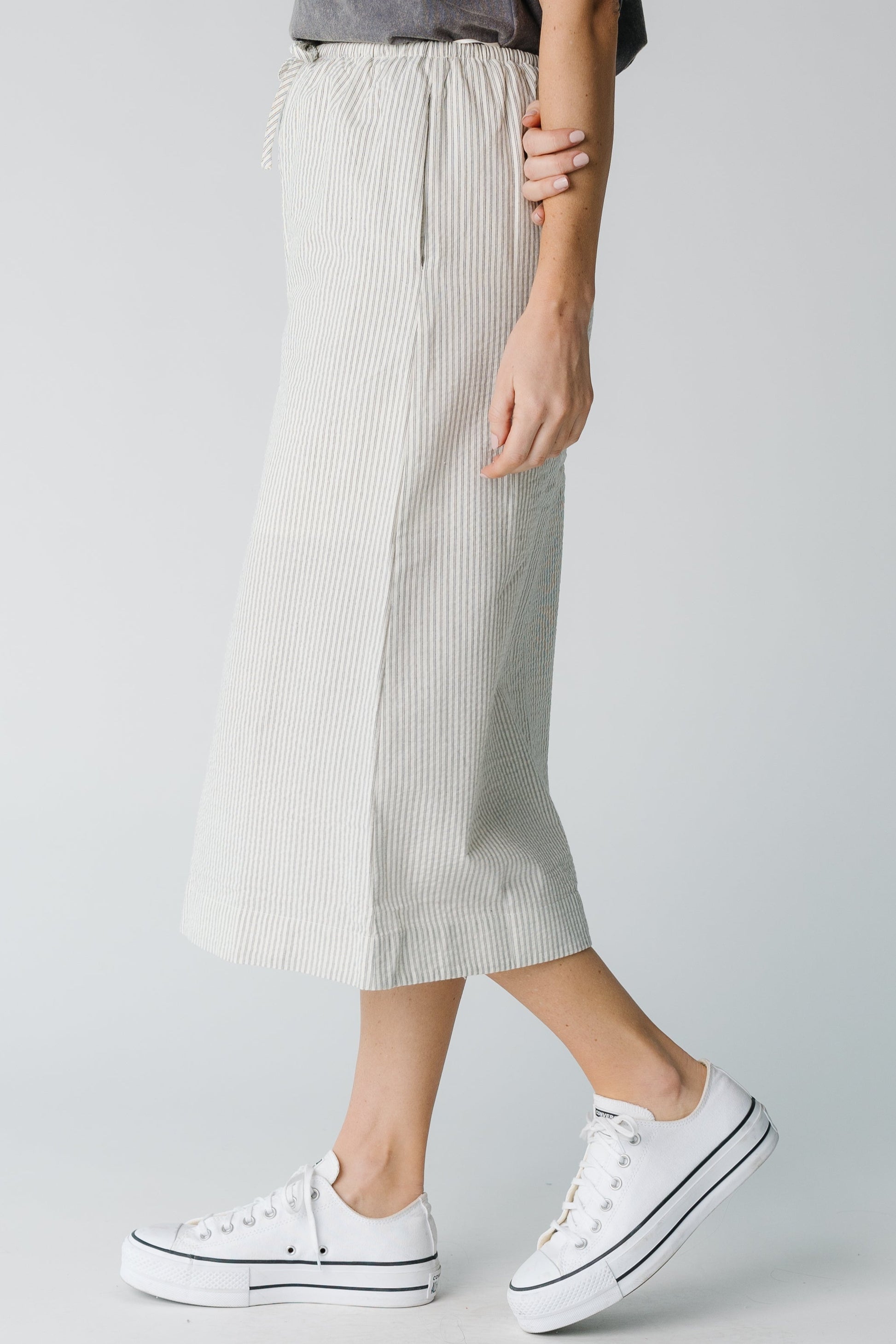 Side view of stripe midi skirt in ivory and blue