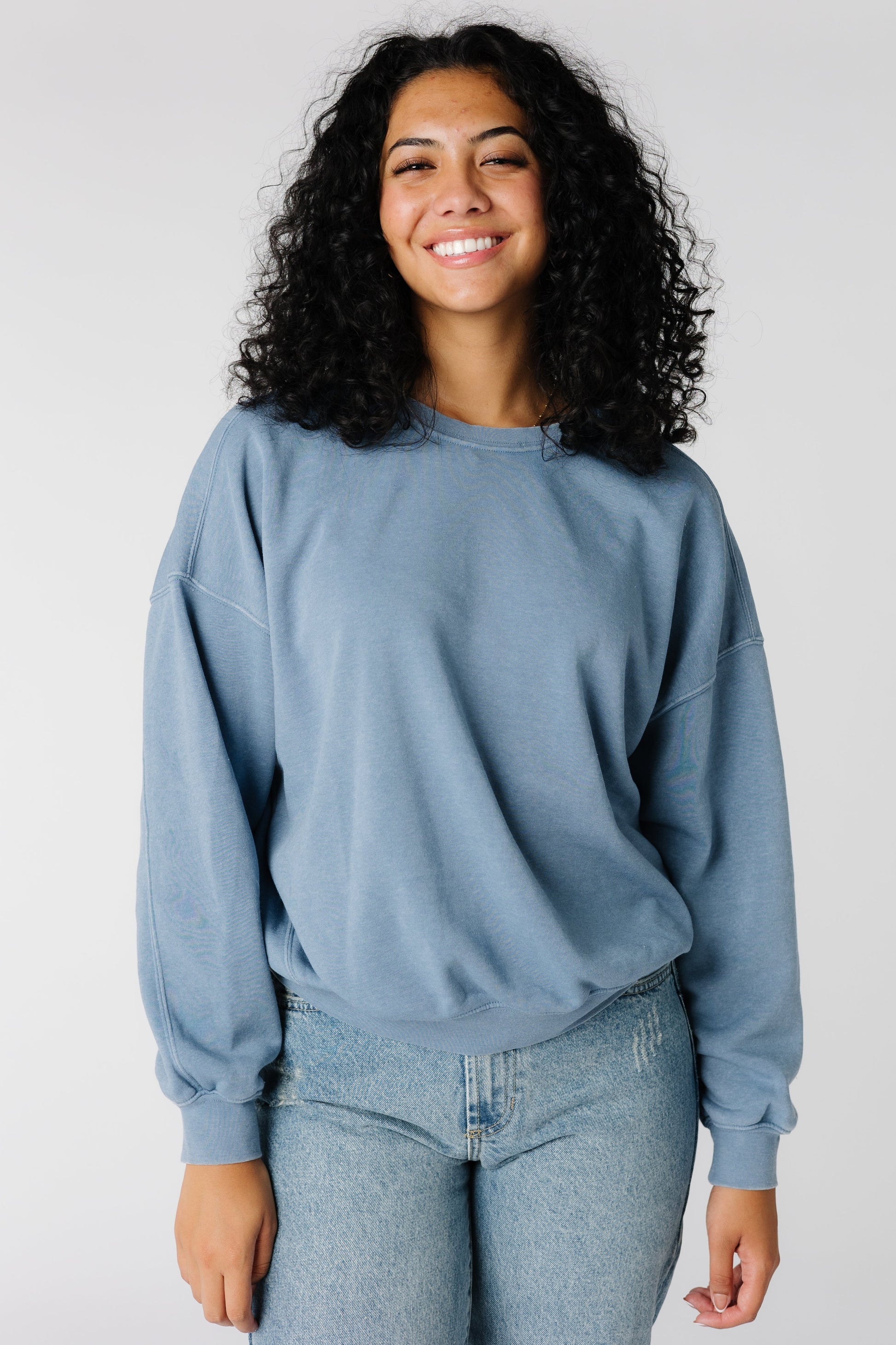 Long sleeve blue sweatshirt with drop shoulders and crew neckline