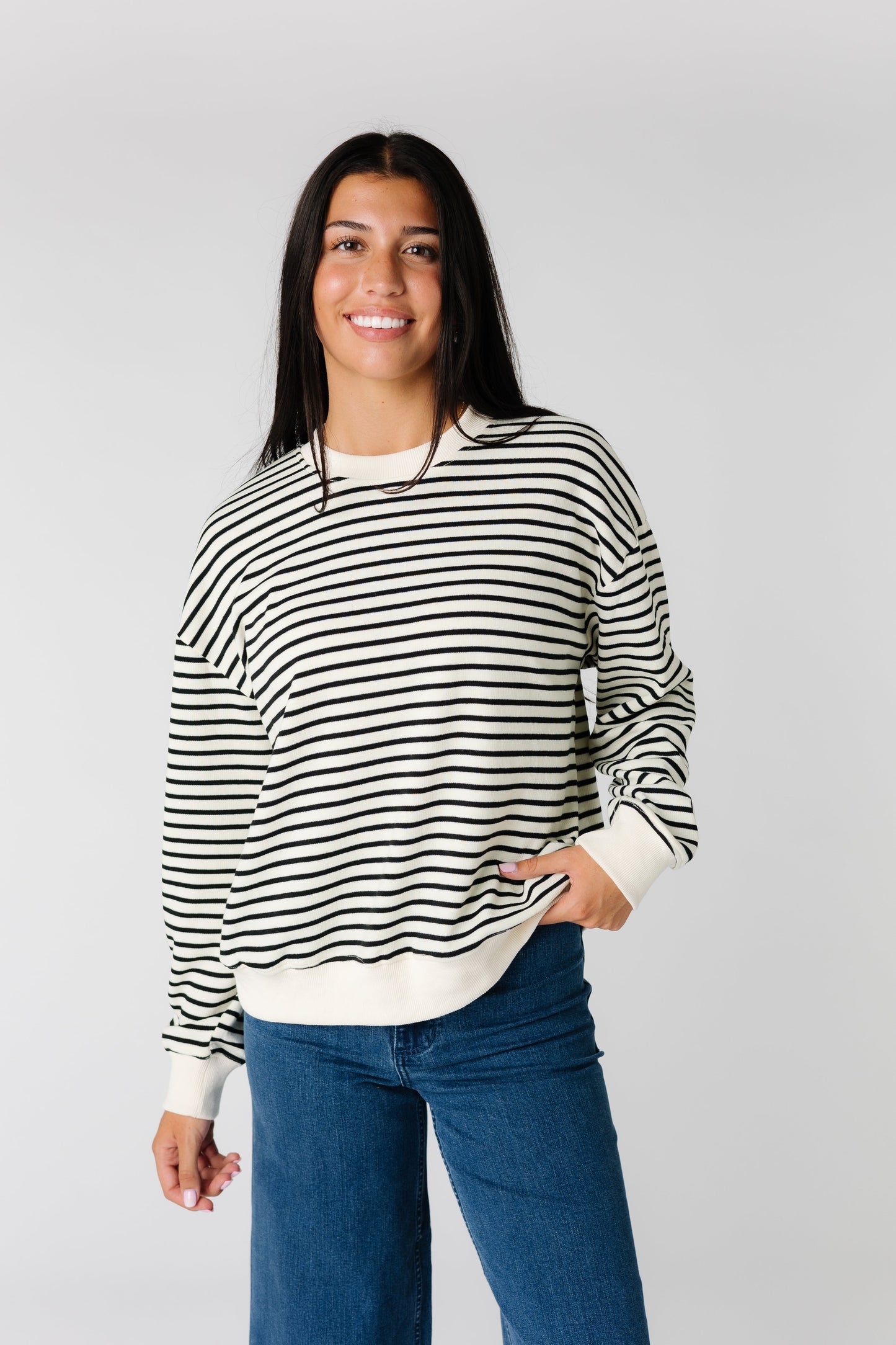 Loose fitting black and white stripe sweater with long sleeves