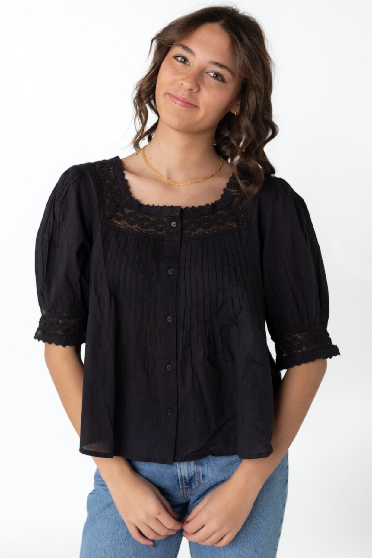 Modest woven button down top is black with square lace neckline and short sleeves