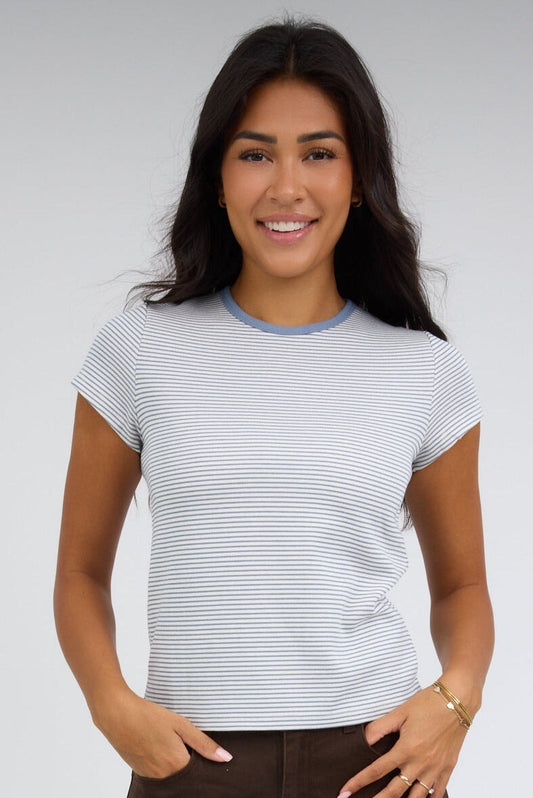 Young woman wearing a modest blue & white stripe short sleeve tee.