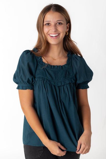 Teal top with short puff sleeves and ruffled scoop neckline