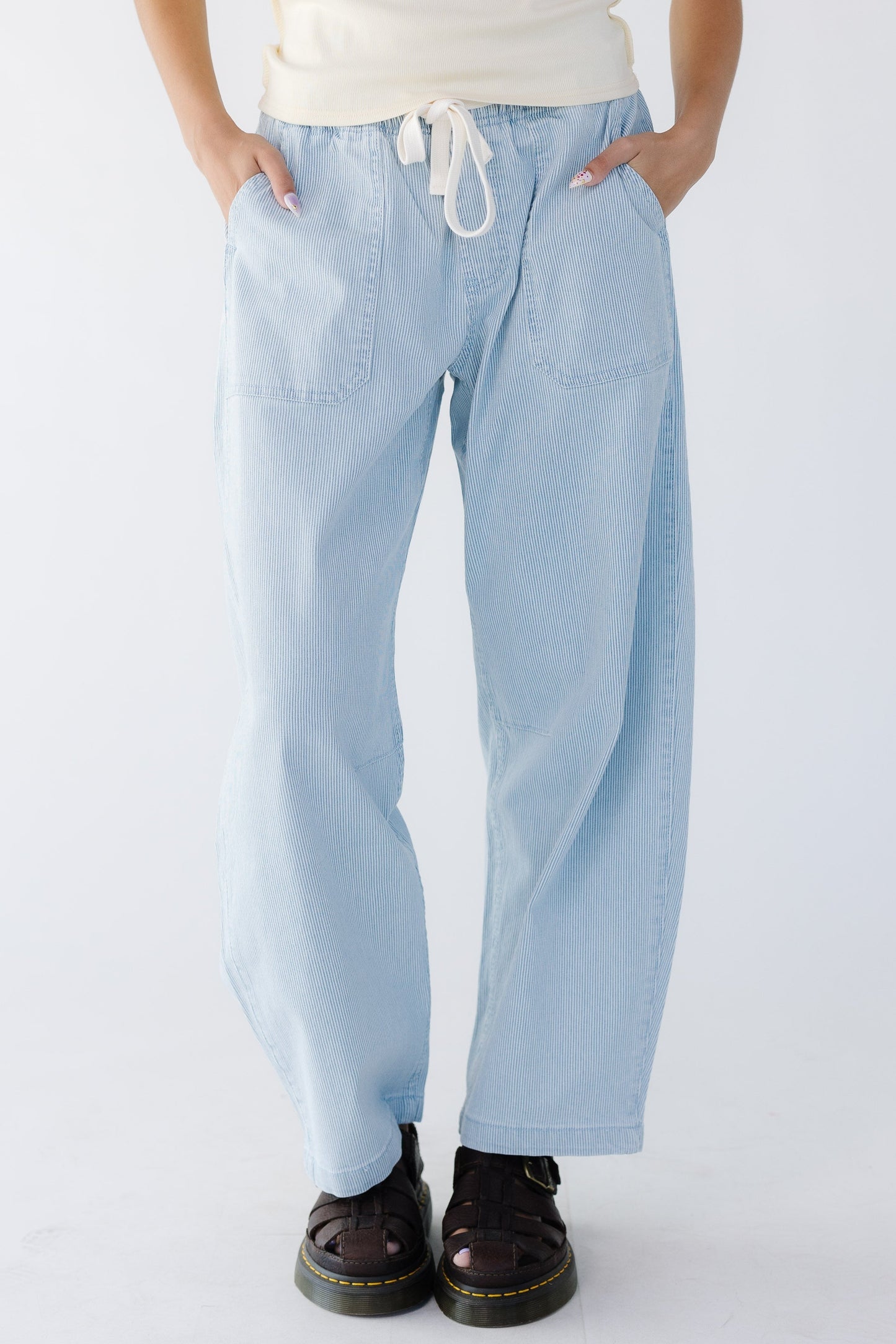 Avril Pants in blue and white pinstripe denim for women and teens.