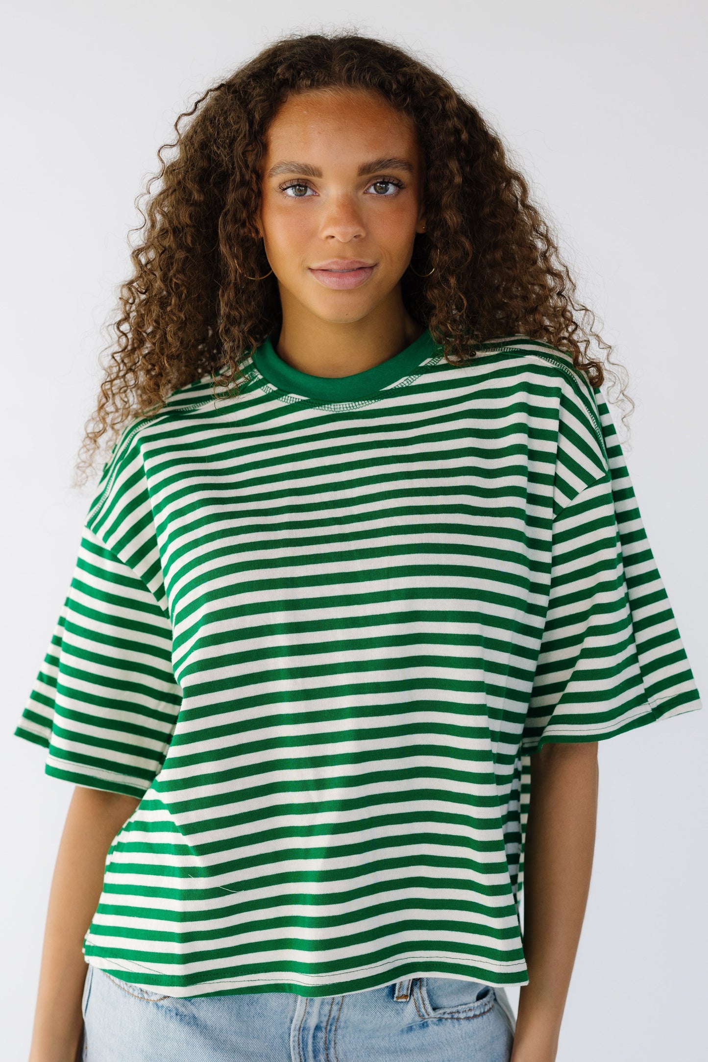 The Esme Top in green and white stripe for women and teens.