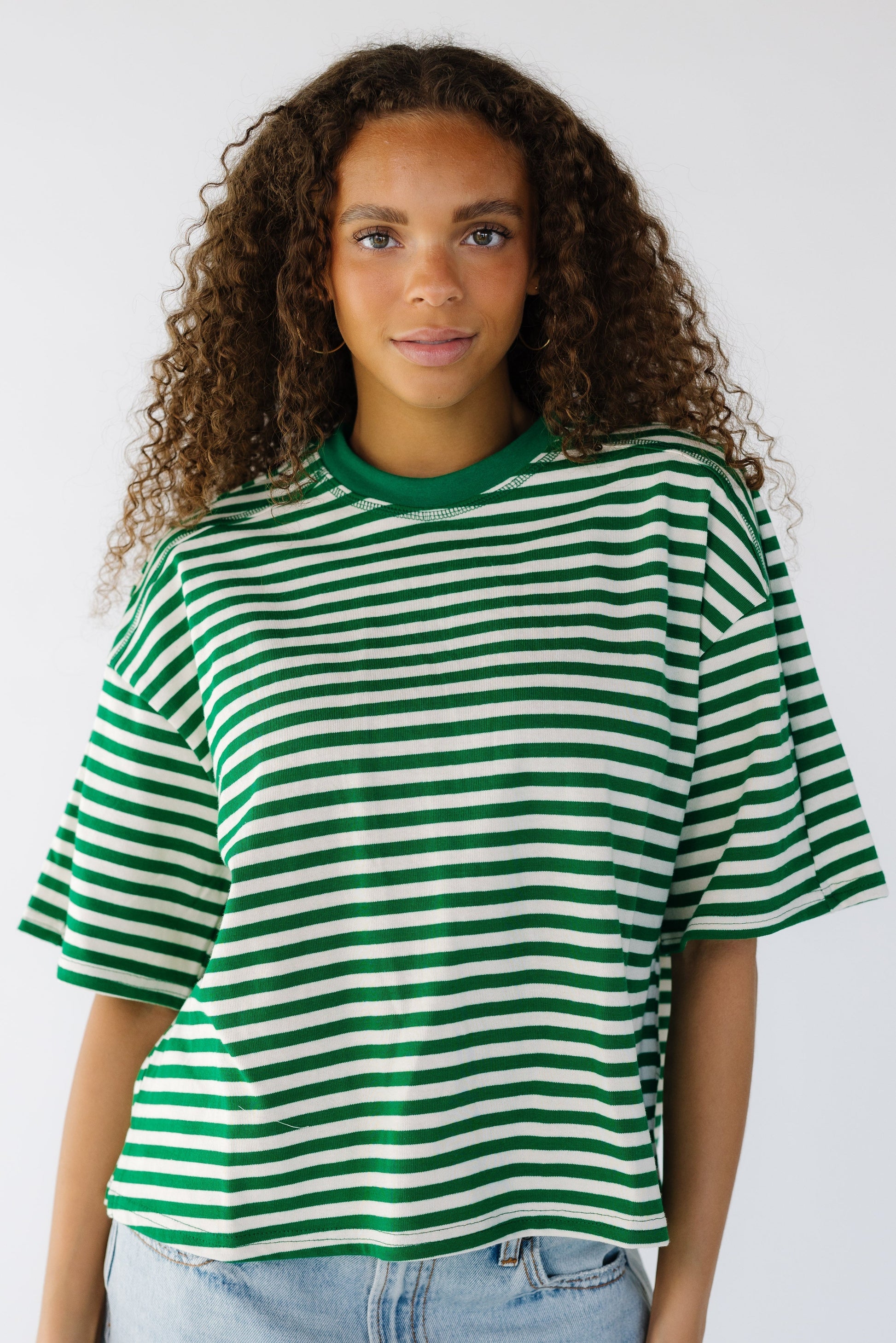 The Esme Top in green and white stripe for women and teens.