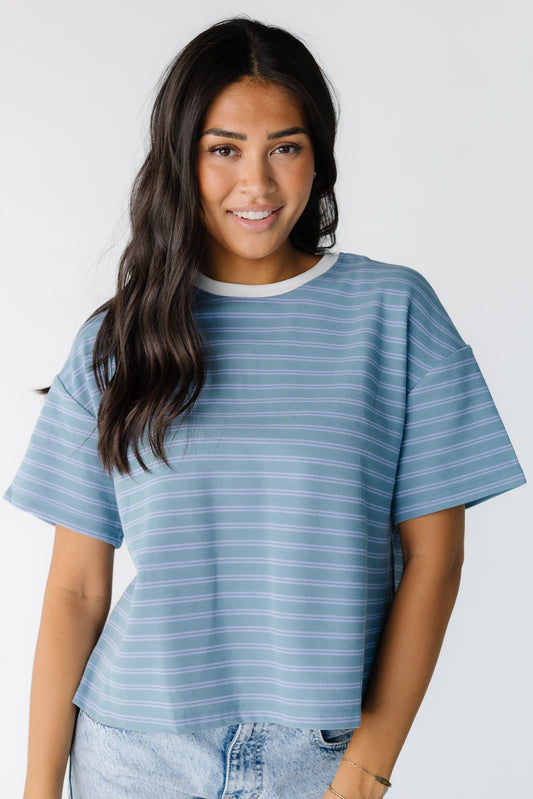 The Blake Striped Tee in a green and blue stripe tee with a white crew neckline for women and teens.