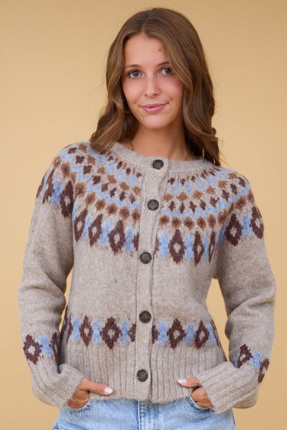 The Davis Cardigan in beige with a blue & brown nordic pattern for women & teen girls.