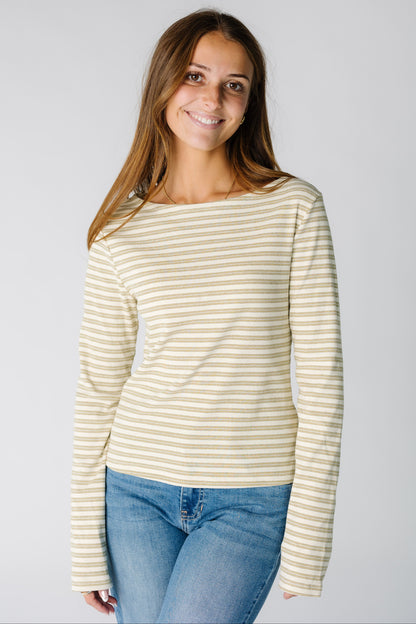 Woman wearing a yellow and cream stripe  ribbed top