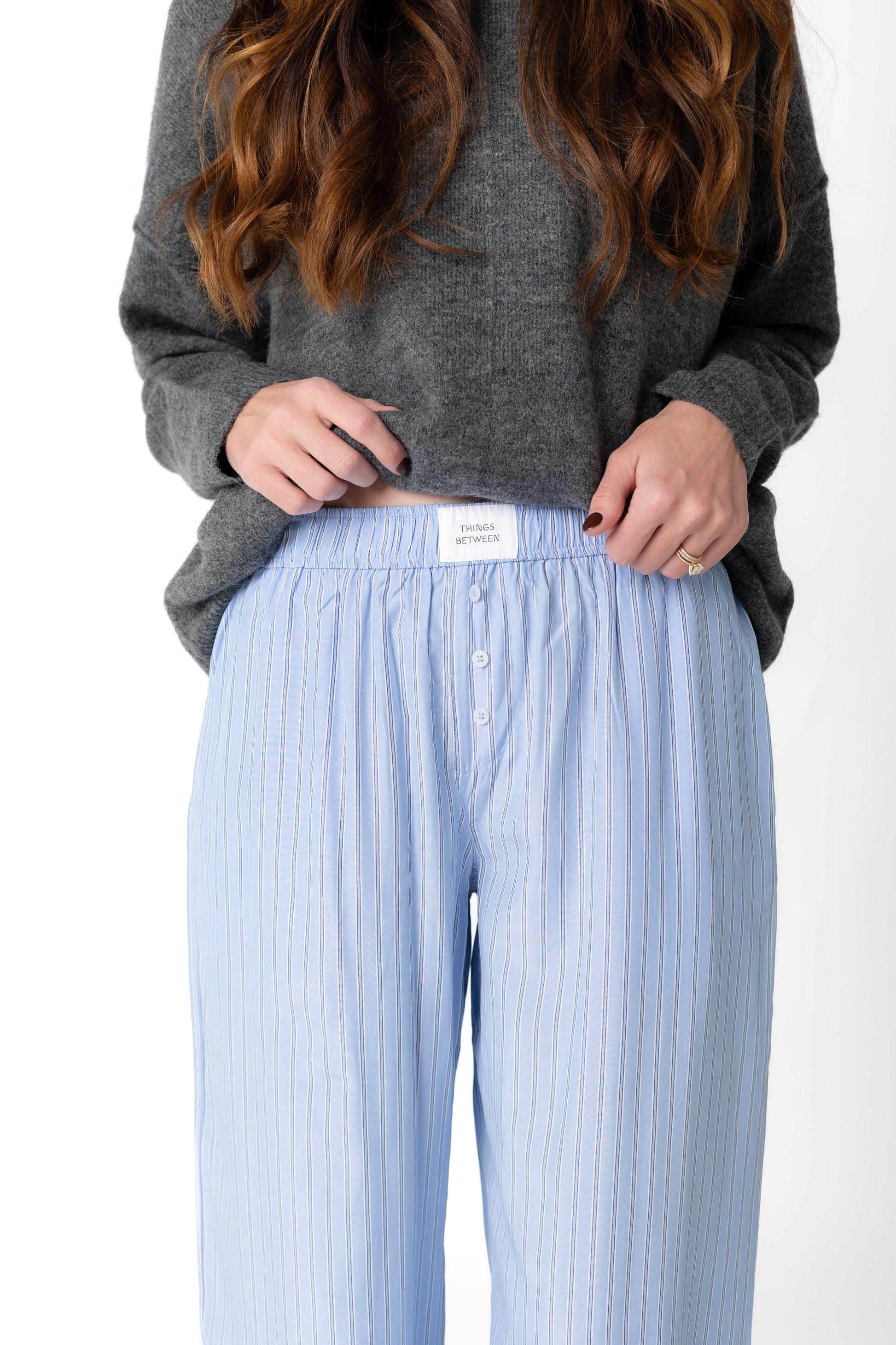 Close view of light blue and white stripe pajama with wide elastic waist